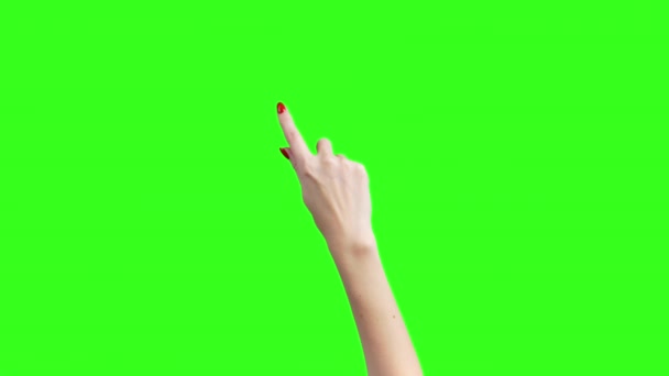 Video van vrouwelijke handen met gebaren voor gadgets op groene achtergrond - Video