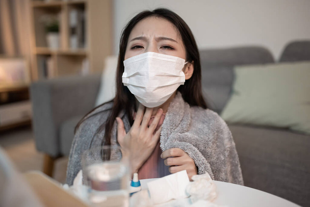 Telemedicine concept - asian woman patient is talking about her sick symptom online at home - Fotó, kép