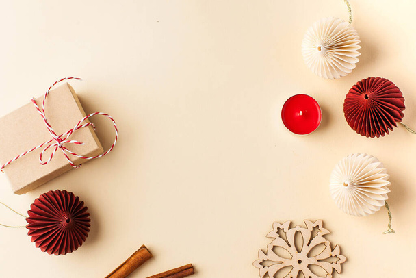 Beige Christmas background with Christmas toys, gift box. Christmas card. Copy space. High quality photo - Φωτογραφία, εικόνα