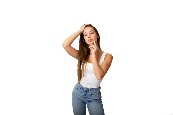Beautyful skin care woman in jeans and a white T-shirt , beauty concept healthy face makeup, female model portrait. Spa model girl with beautiful lips neck and shoulders. Copy space. Isolated - Fotó, kép