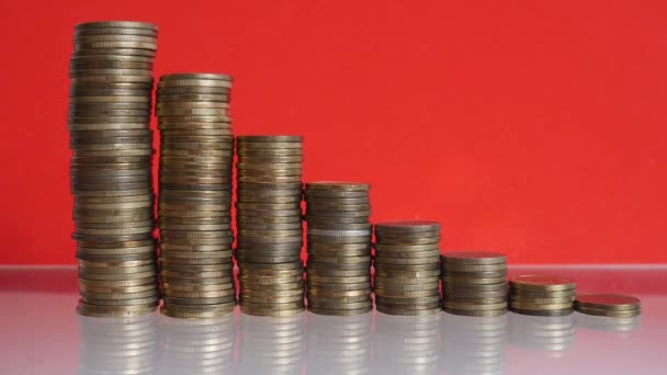 Coins on a red background. Economics and Finance old money. - Footage, Video