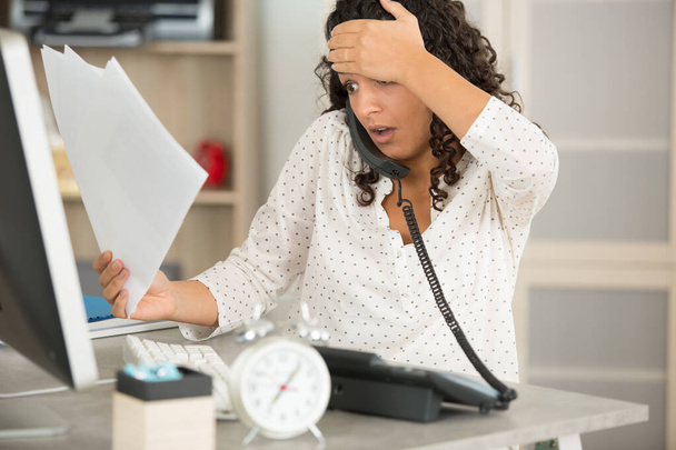 woman at office in stress about meeting work deadline - Valokuva, kuva
