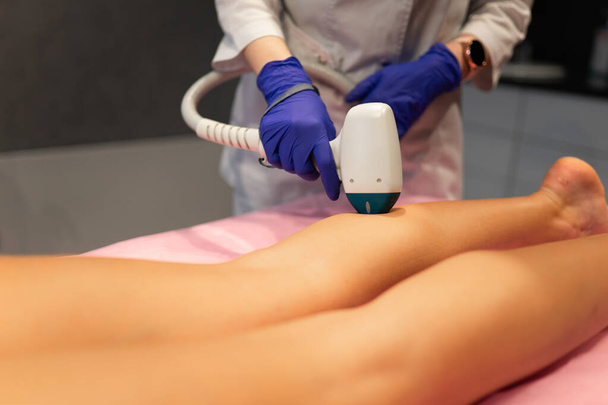 Laser depilation leg hair removal therapy - Foto, Imagen