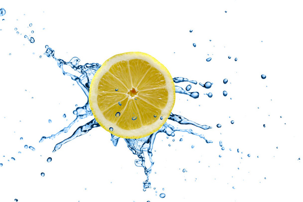 Lemon slice in splashing water isolated on white. Close up, copy space - Foto, Imagen