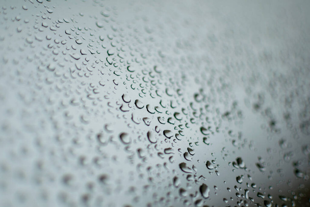 close up raindrops on a window during a rainy day in Marbella, Spain  - Photo, Image