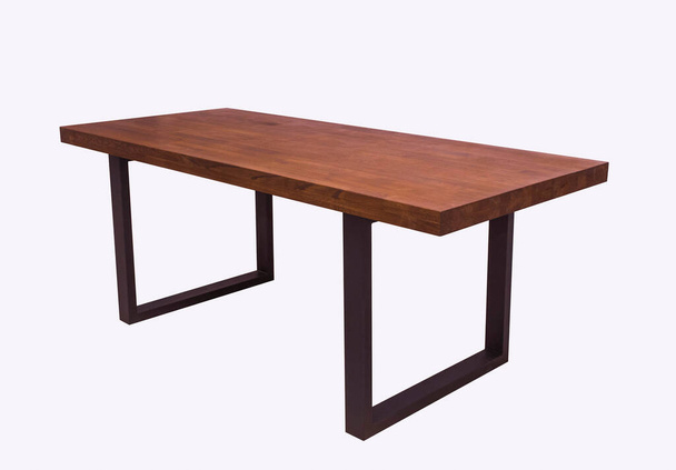 wooden lacquered table with black metal legs on white background standing at an angle of 45 degrees - Фото, изображение