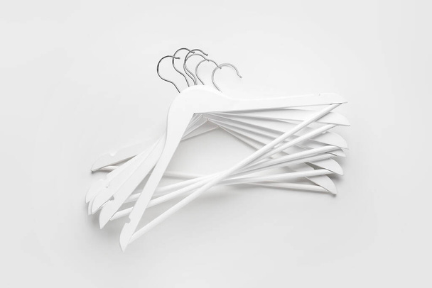Clothes hangers on white background - Foto, afbeelding