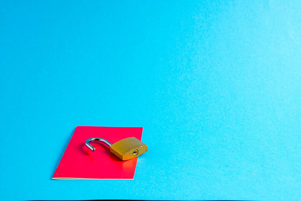 Passport with open padlock on blue - Fotoğraf, Görsel