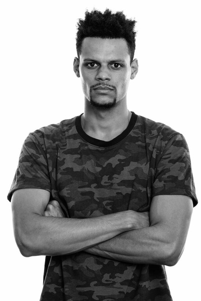 Studio shot of young African man with arms crossed - Foto, Imagen