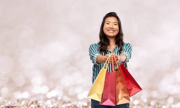 happy asian woman with shopping bags - Photo, Image