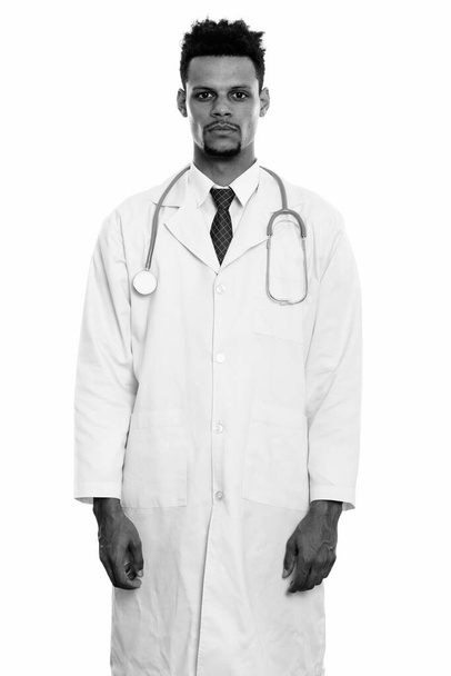 Studio shot of young African man doctor standing - Foto, imagen
