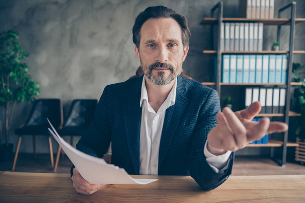 Close-up portrait of his he nice attractive man qualified expert reading discussing paperwork hiring talented staff team building offer responsibilities modern concrete industrial work place station - Fotoğraf, Görsel