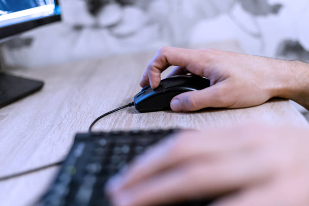 male hand on a computer mouse - Photo, Image