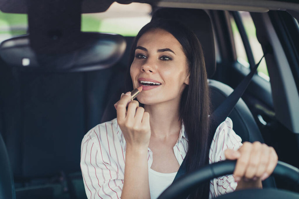 Close-up portrait of her she nice attractive lovely pretty successful glamorous girl worker riding car making visage applying nude lip balm wellness wellbeing traffic jam free time - Photo, Image