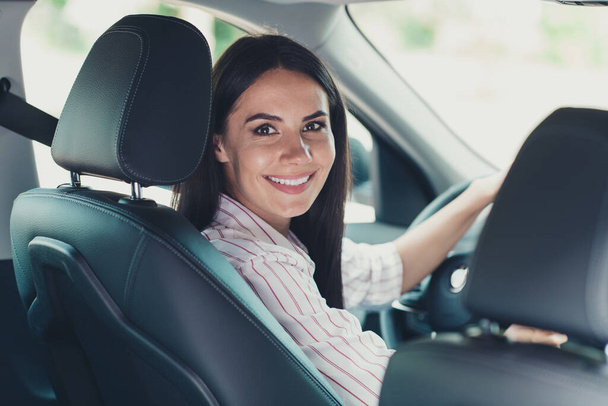 Close-up profile side view portrait of her she nice attractive lovely pretty cute successful cheerful content girl worker assistant secretary riding car early morning order delivery service - Foto, imagen