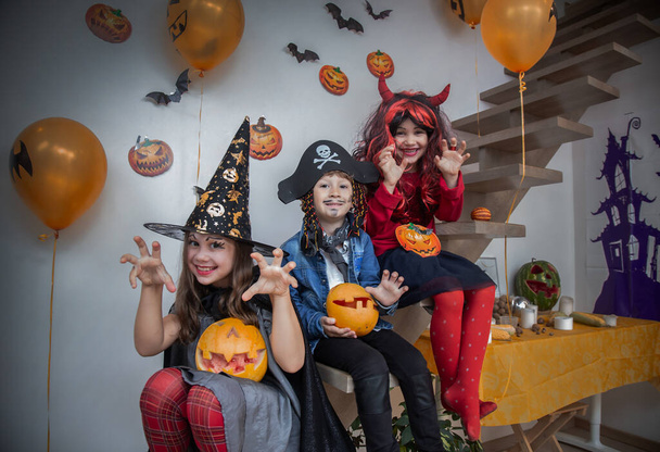 Children playing in the attic at home on a halloween holiday - Foto, Imagen