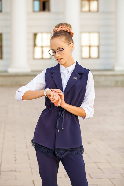 Portrait of a young beautiful girl in a business style - Фото, зображення