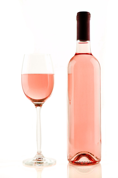 Bottle and glass of rose wine isolated - Photo, Image
