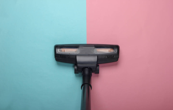 Vacuum cleaner brush on pink blue pastel background. Top view. Cleaning concept. - Photo, Image