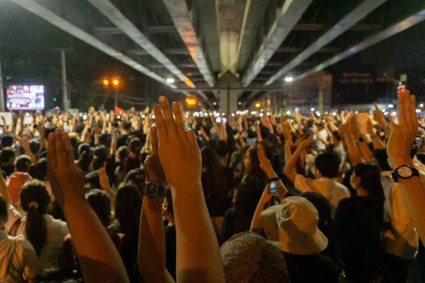 BANGKOK, THAILAND - 19 October  2020 : Many people raised their hands to protest the Thai government. - Photo, Image