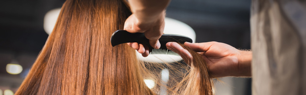 hairstylist combing hair of woman on blurred foreground, banner - Foto, imagen