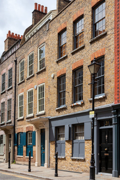 London, UK, July 1, 2012 : Georgian terraced town house in Spitafields once the home of a wealthy Huguenot silk merchant and is a popular travel destination tourist attraction landmark stock photo - Photo, image