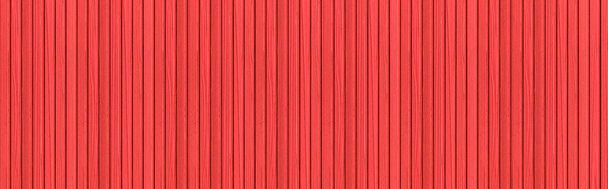 縞模様の質感とシームレスな背景と現代の赤い石の壁のパノラマ - 写真・画像