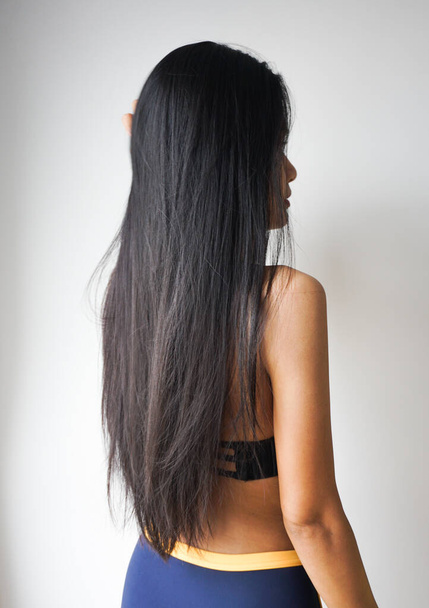 Woman with beautiful long straight black hair. - Photo, Image