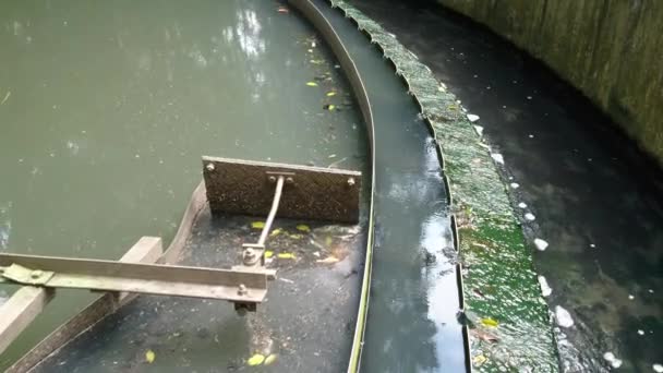 Close-up of the effluent launder, V-notched weir and scum baffle of the clarifier. It removes suspended solids from liquid for thickening as the skimmer arm moves.  - Footage, Video