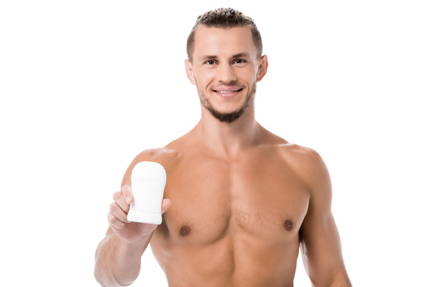 smiling sexy shirtless man with deodorant isolated on white - Valokuva, kuva