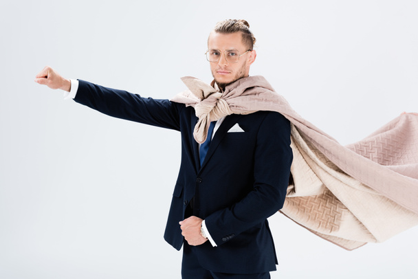 young businessman in cape isolated on white - Valokuva, kuva