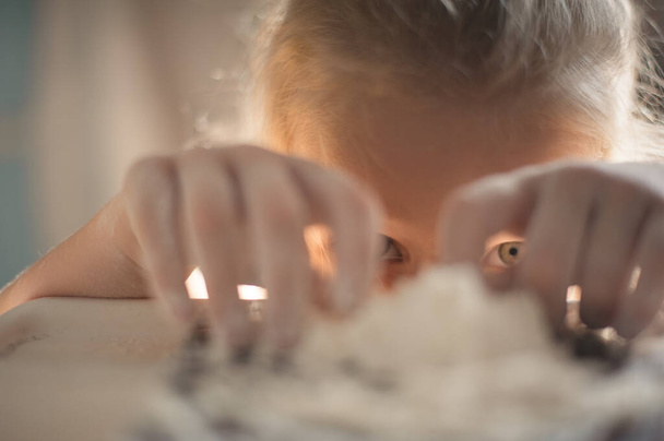 girl playing with flour. Close-up portrait of a girl playing with flour - Fotografie, Obrázek