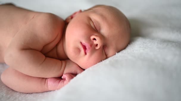 Cute emotional newborn yawning funny little baby boy sleeping in crib. Infant baby. Nursery - Footage, Video