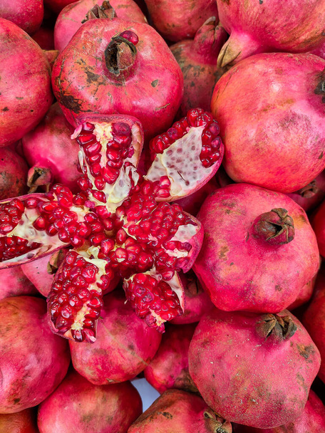 Fresh natural fruit pomegranate on a shop counter. - Photo, Image