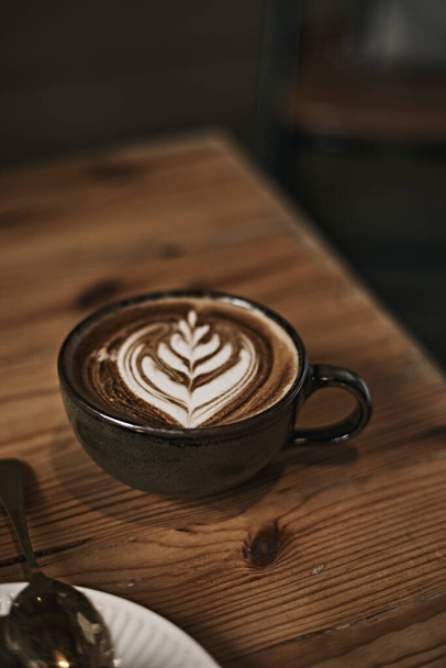 Selective focus cup of hot latte art coffee,focus at white foam - Φωτογραφία, εικόνα