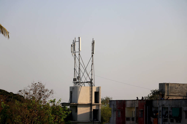 telecommunication tower on top of building terrace - Photo, Image