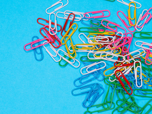 Collection of colorful paper clips on blue background - Φωτογραφία, εικόνα