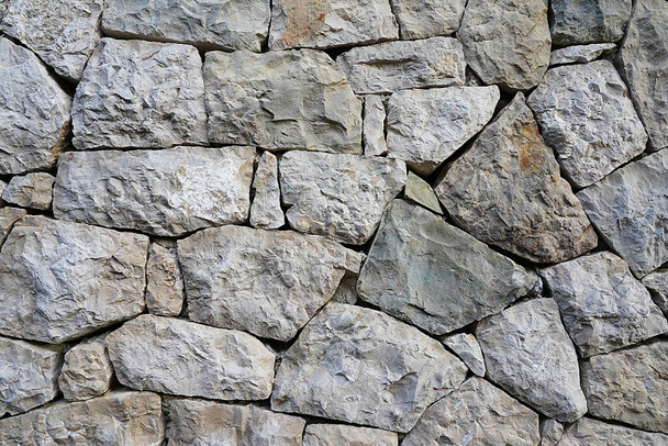 Parte de uma parede de pedra, fundo de pedra. - Foto, Imagem