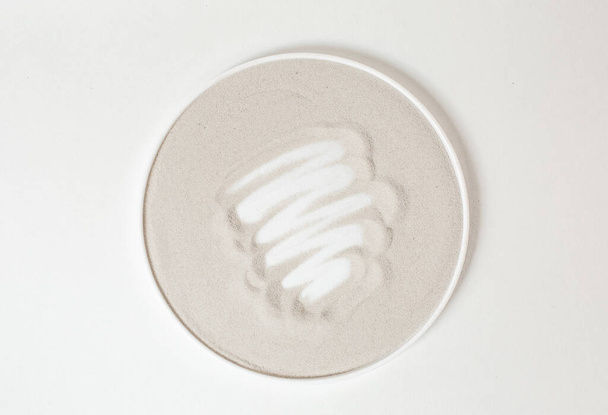 circle beige with strokes of white cream in the cente - Φωτογραφία, εικόνα