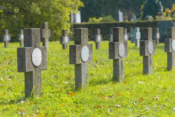 Old military stone crosses from World wars in a cemetery - 写真・画像