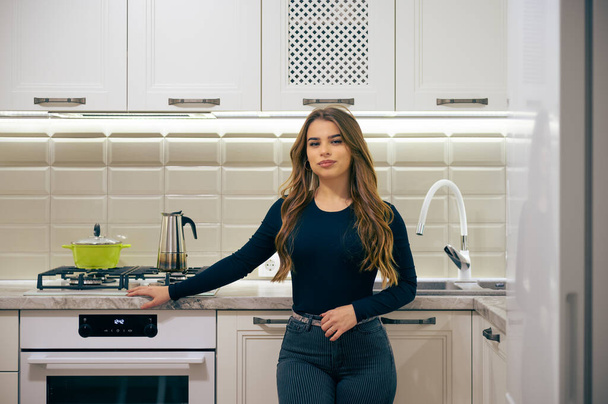 Young woman at luxury white classic kitchen interior - Photo, Image