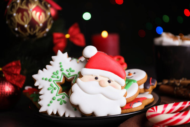 Bright delicious Christmas cookies on table, closeup - Fotó, kép