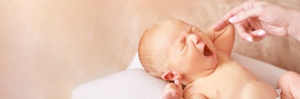 Tiny newborn. Mother touch little people. Healthcare massage concept - Foto, Imagem