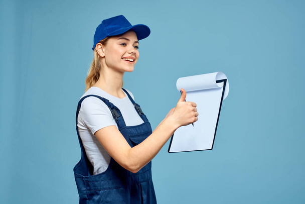 Woman in working form paperwork rendering services career office blue background - Фото, изображение