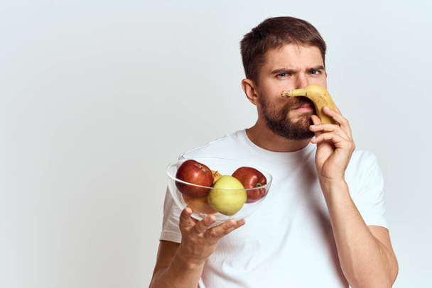 man with fresh fruit in a glass cup gesturing with hands vitamins health energy model bushy beard mustache - Foto, Imagen
