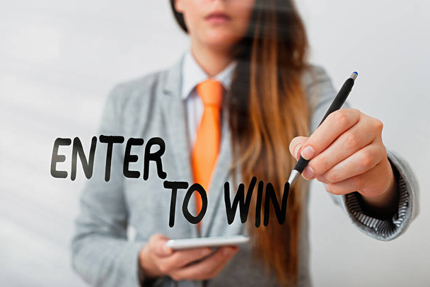 Word writing text Enter To Win. Business concept for exchanging something value for prize or chance of winning Model displaying different shots of holding pen ready for promotional use. - Photo, Image