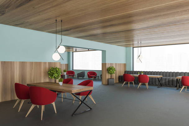 Ecke des stilvollen Esszimmers mit blauen und hölzernen Wänden, Betonboden, Esstisch mit roten Sesseln und Wohnzimmer im Hintergrund. 3D-Darstellung - Foto, Bild