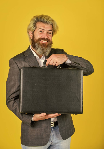 investment in yourself. bearded man show office briefcase. good business deal. successful business concept. rich man with beard. live in luxury. bag with money. happy successful man hold money case - Foto, immagini