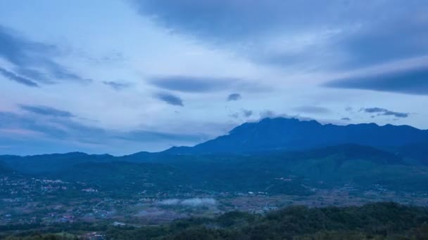 Time lapse sunrise MOUNT KINABALU, moving clouds over a villages. Taken at RANAU, SABAH, BORNEO. time lapse motion zoom in - Footage, Video