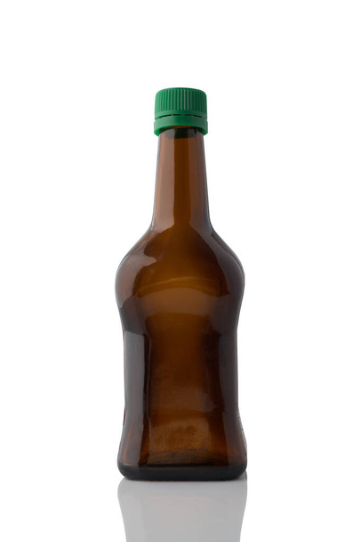 Brown glass bottle with under oil or soy sauce without label isolated on white background. - Fotoğraf, Görsel